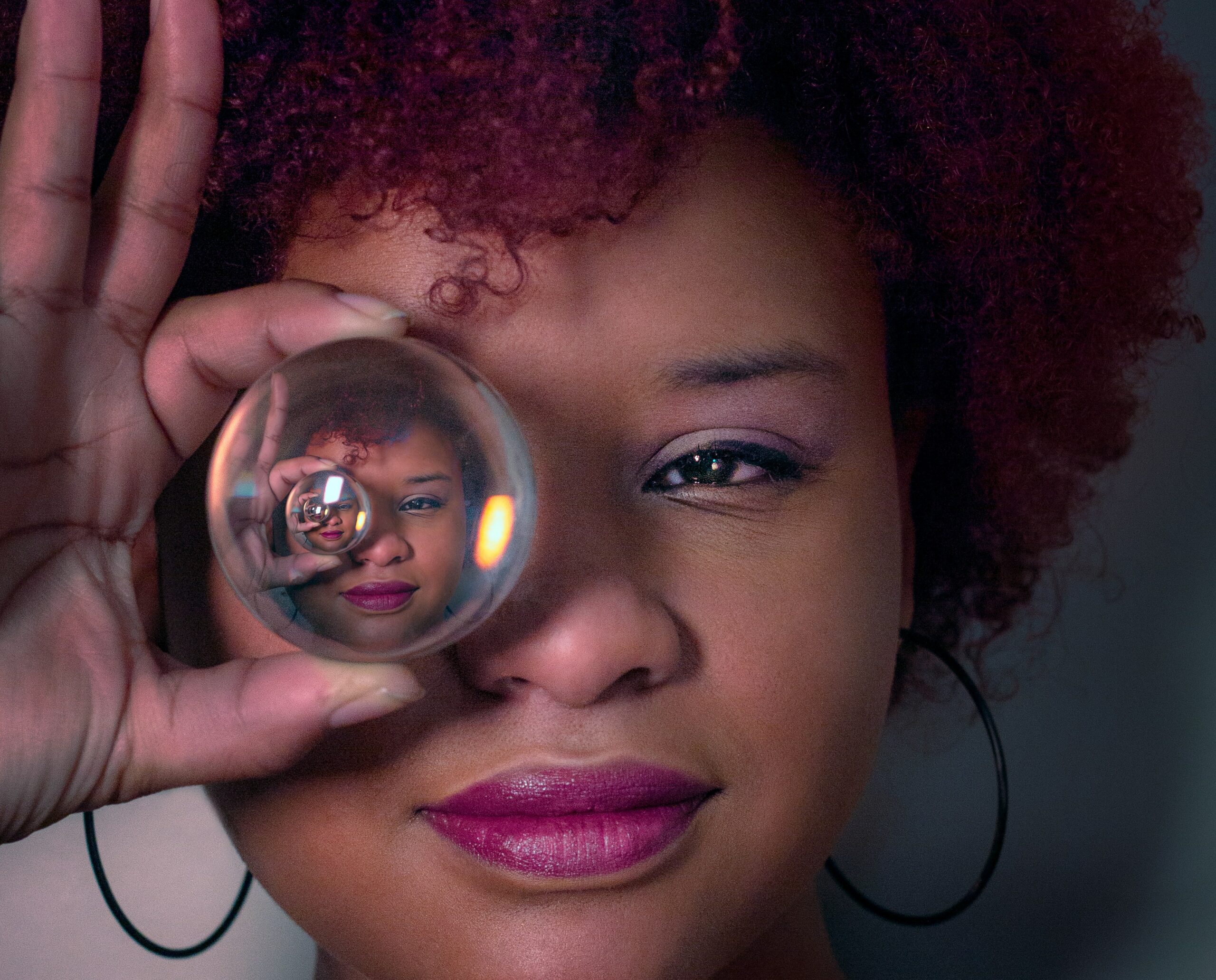 Woman peering into crystal ball